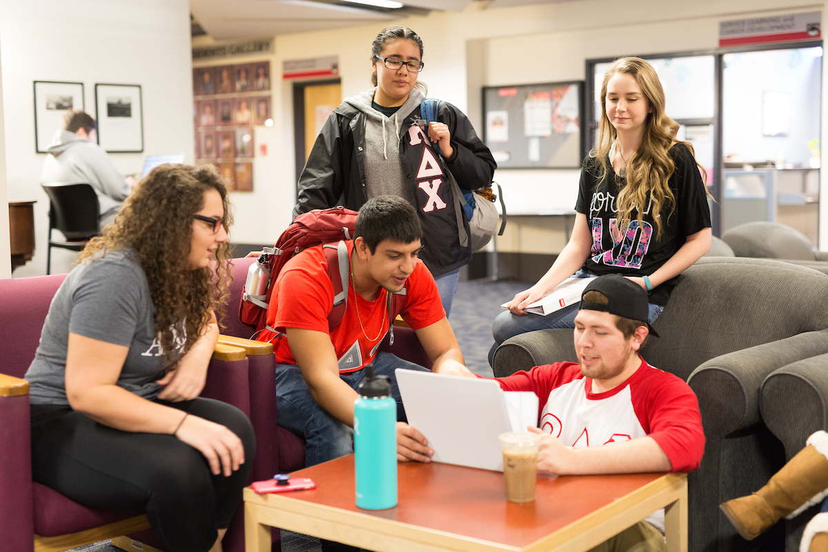 Greek Students gathering around the WUC WOU Wolves Logo
