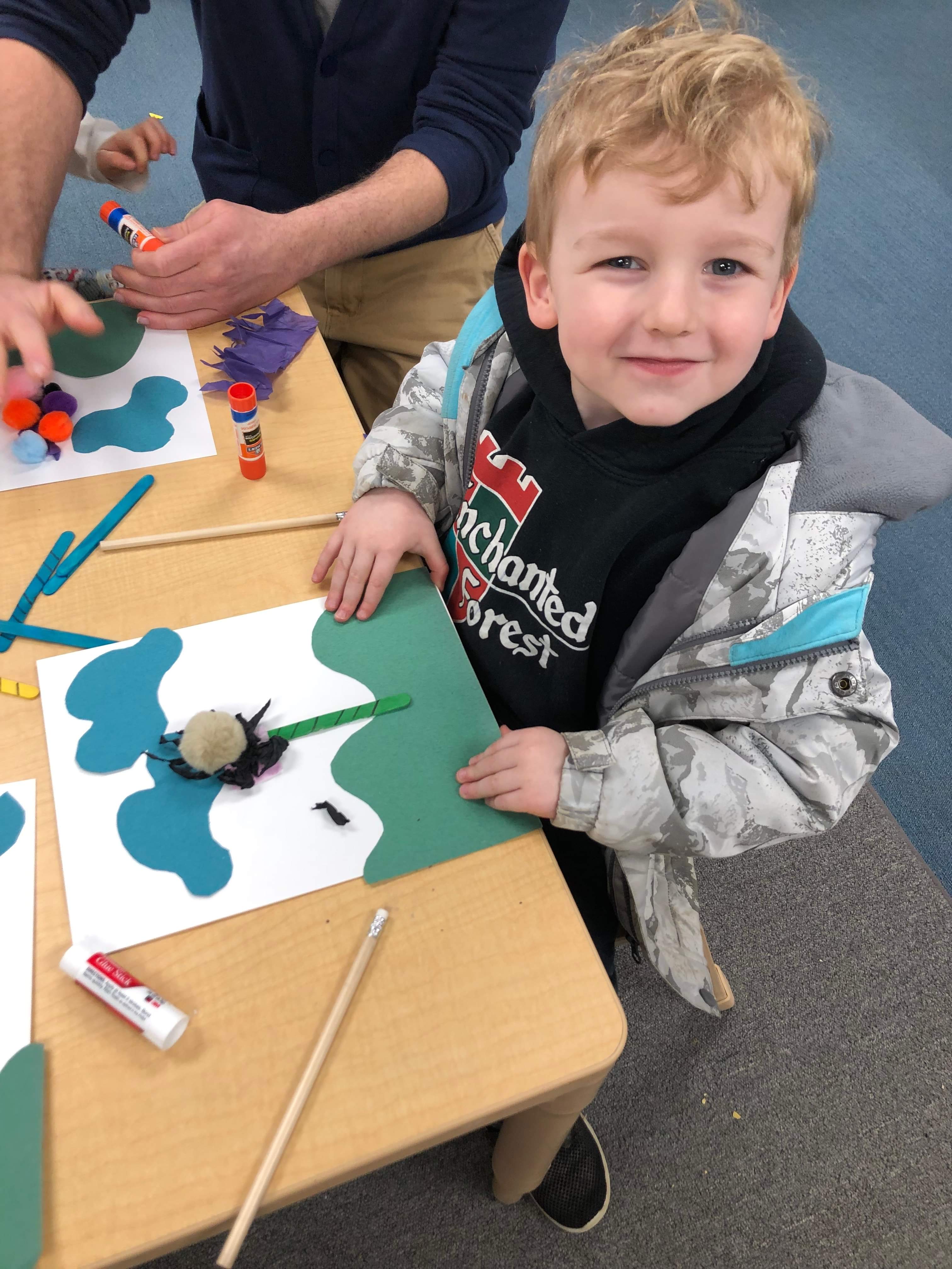 Little boy doing craft project