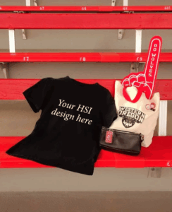 T-shirt on bleachers along with a university tote bag