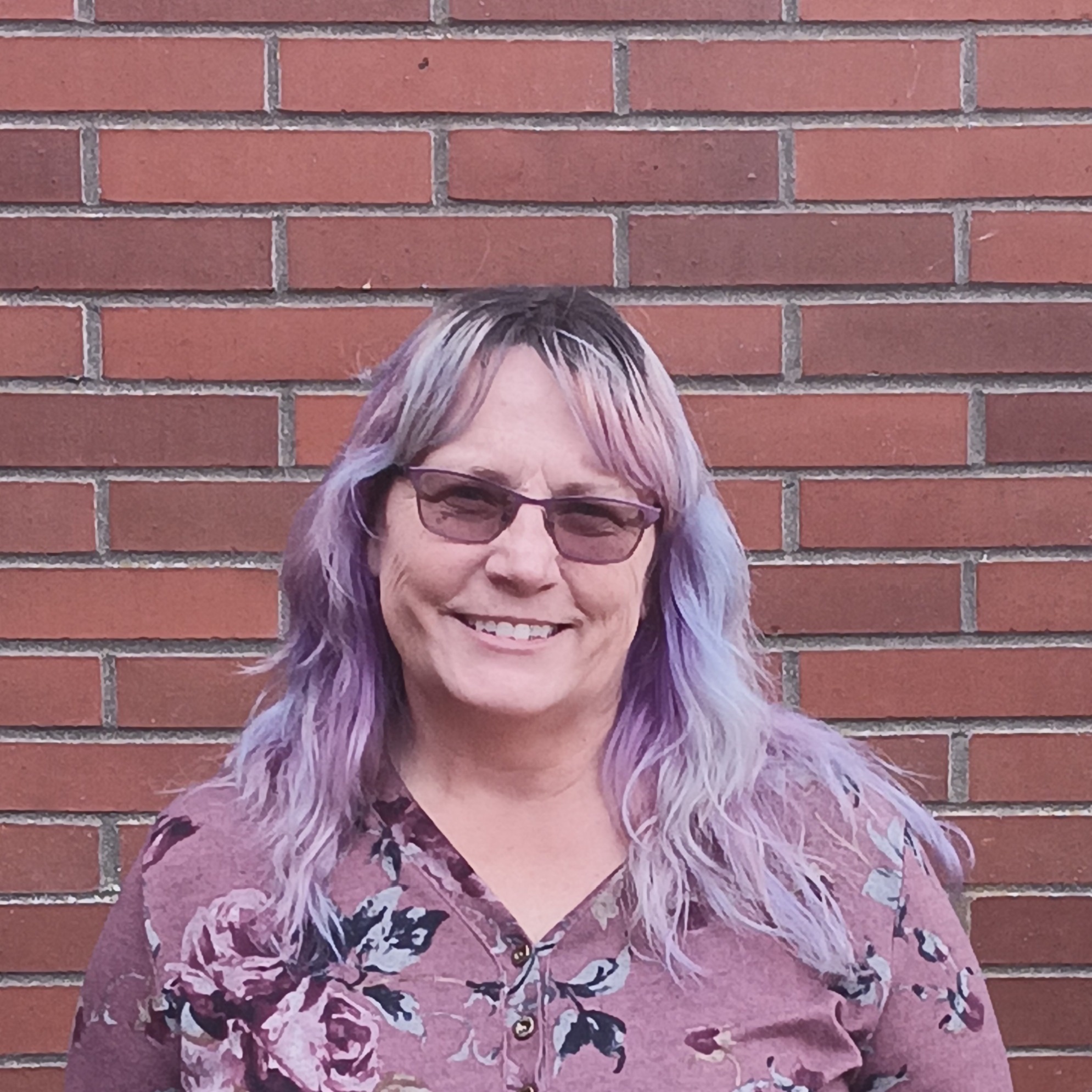 AE woman smiling in the outdoors