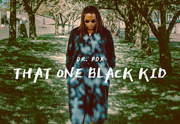 unnamed (2) Music Artist standing in a field with trees