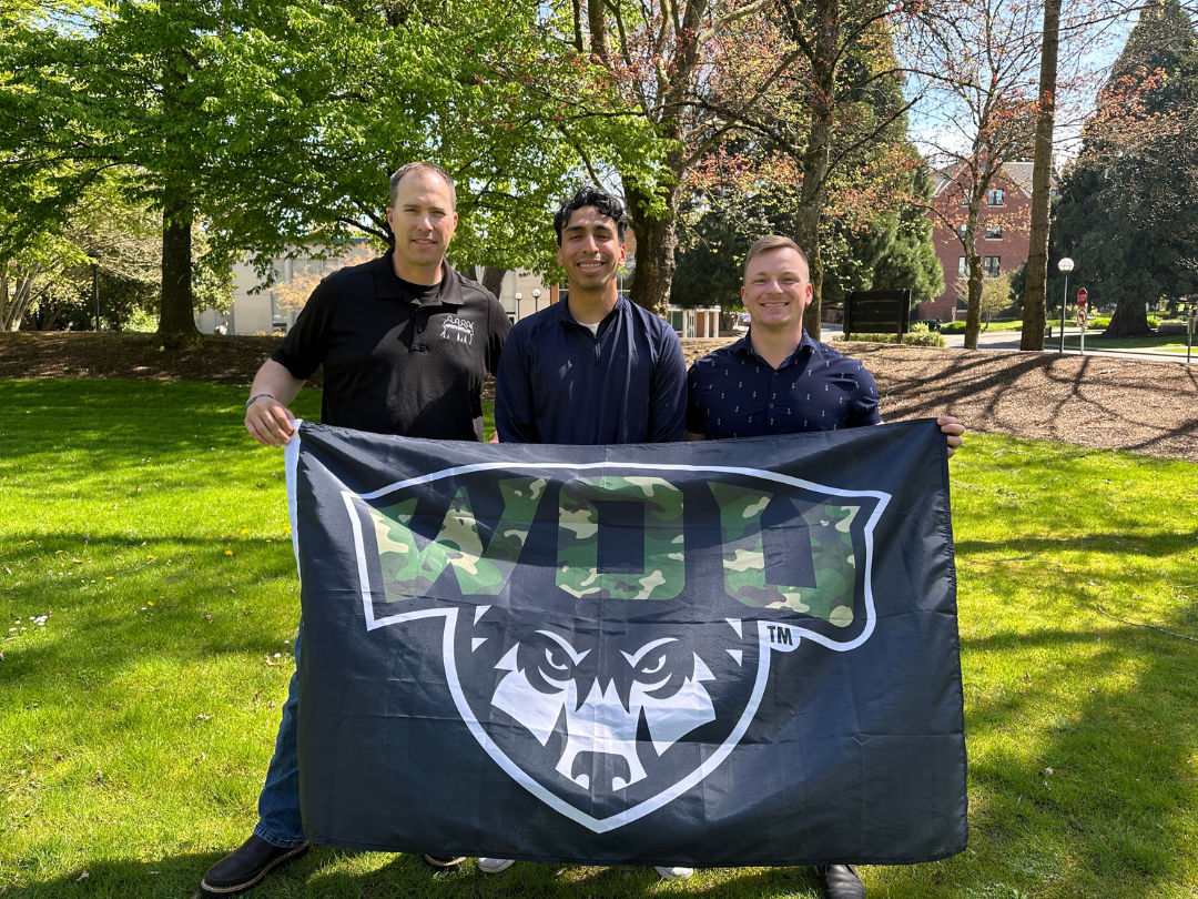 4 Distillery PR Three men holding a WOU military flag