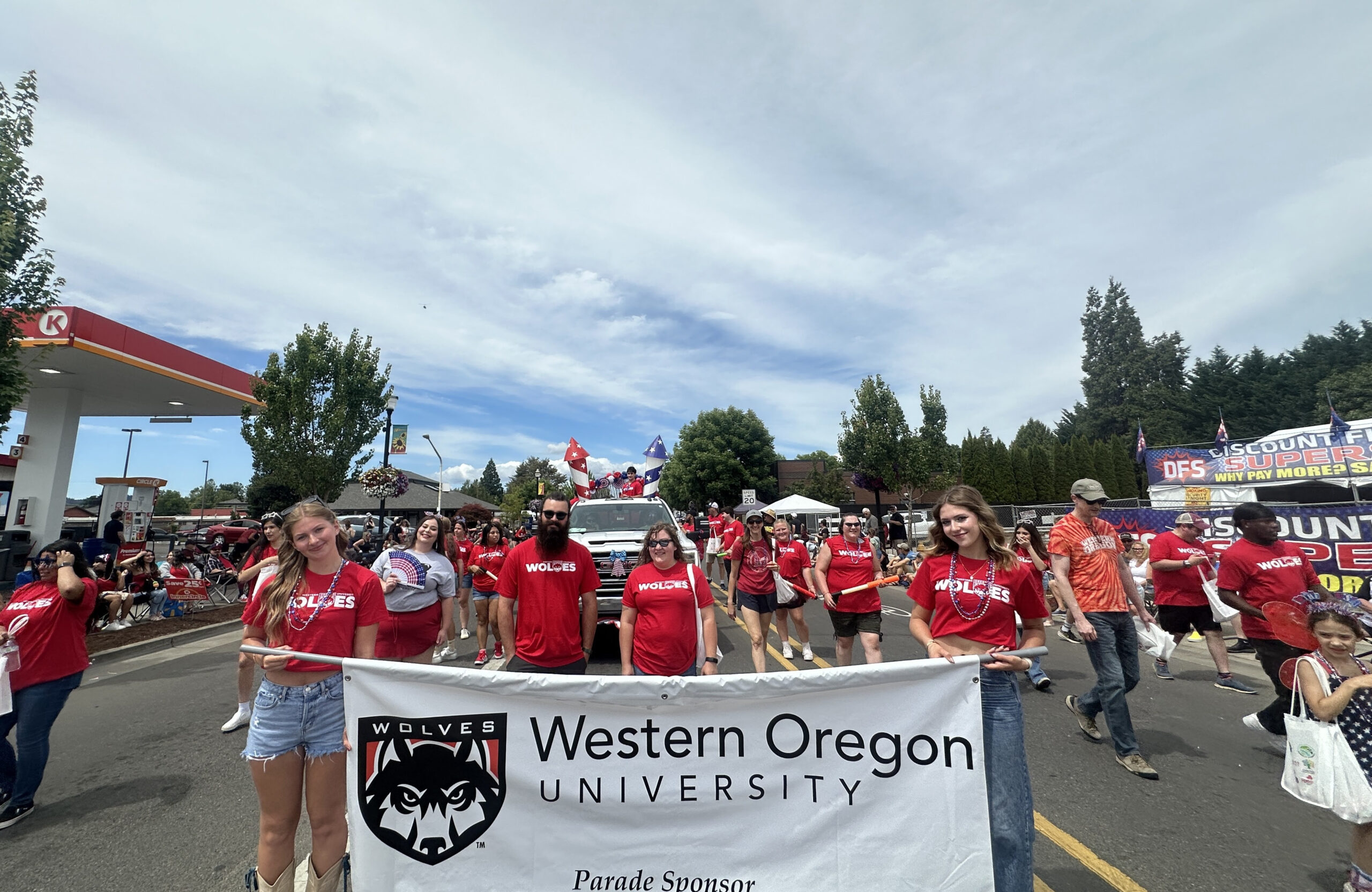 July 4 Parade Group of people holding a banner