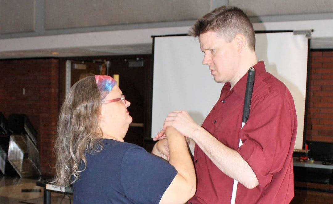 Two people holding hands