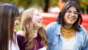 Three women laughing