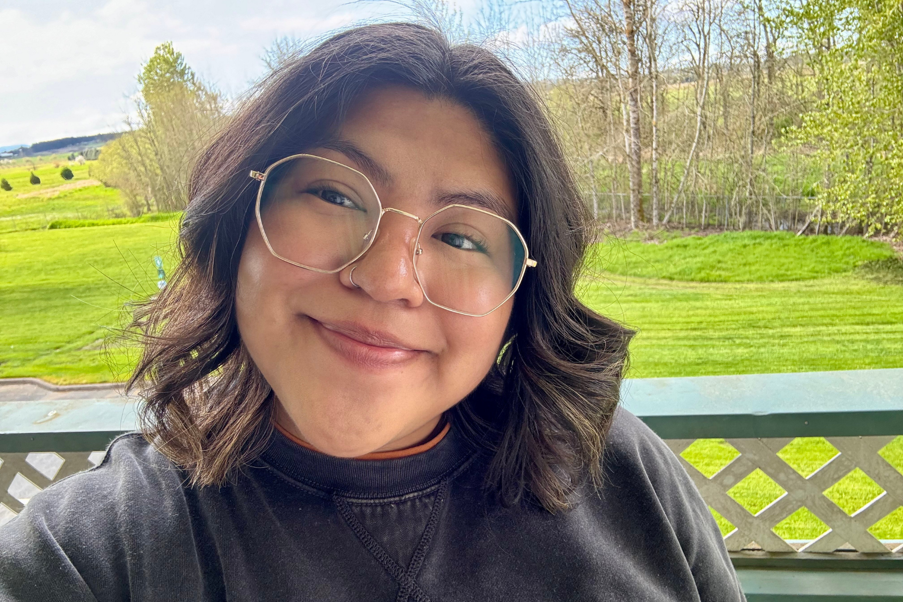 Brittany RJ- WOU Crew woman smiling in the outdoors