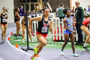 WOU track athlete running with the bhutan