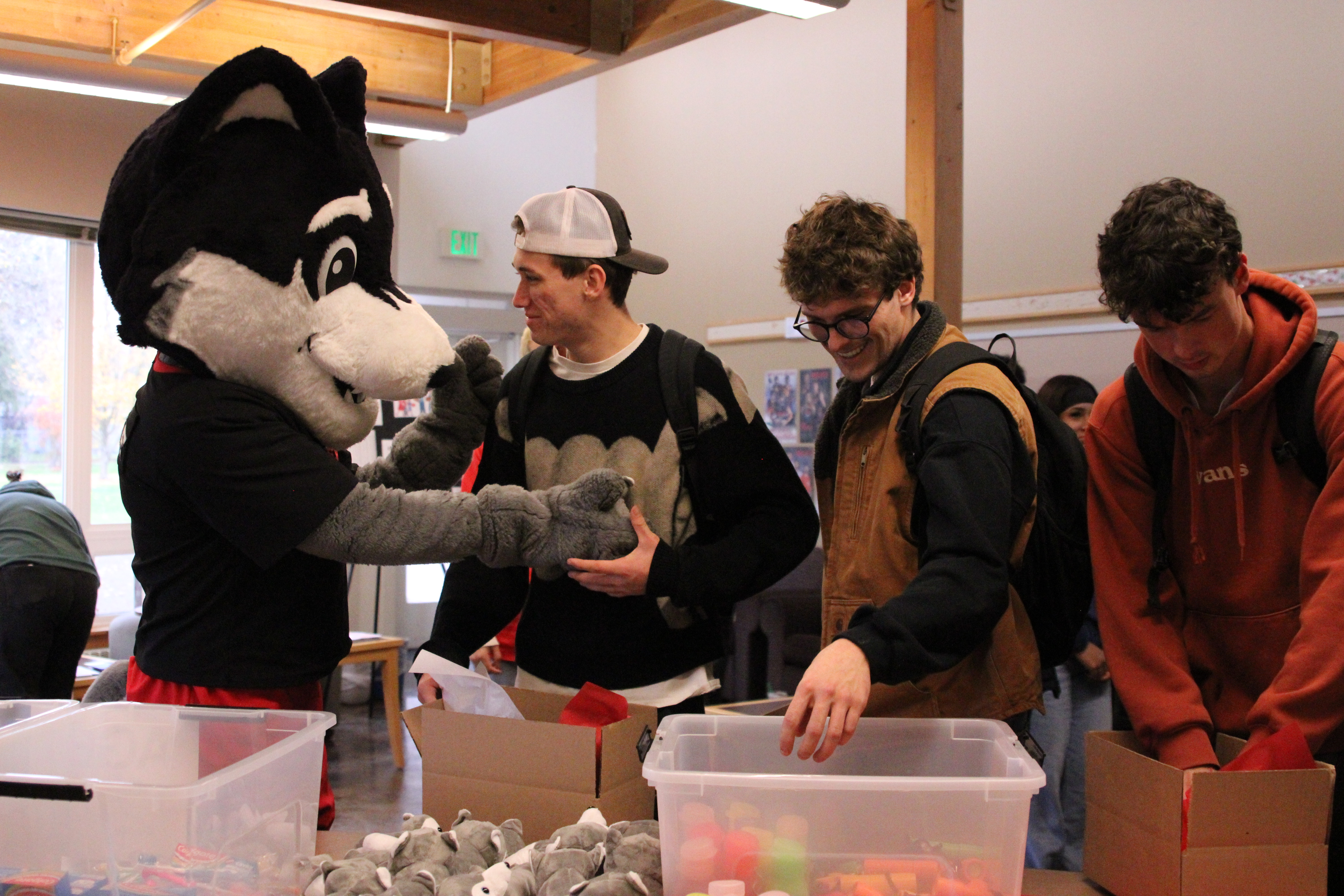 Wolfie with students making care boxes.