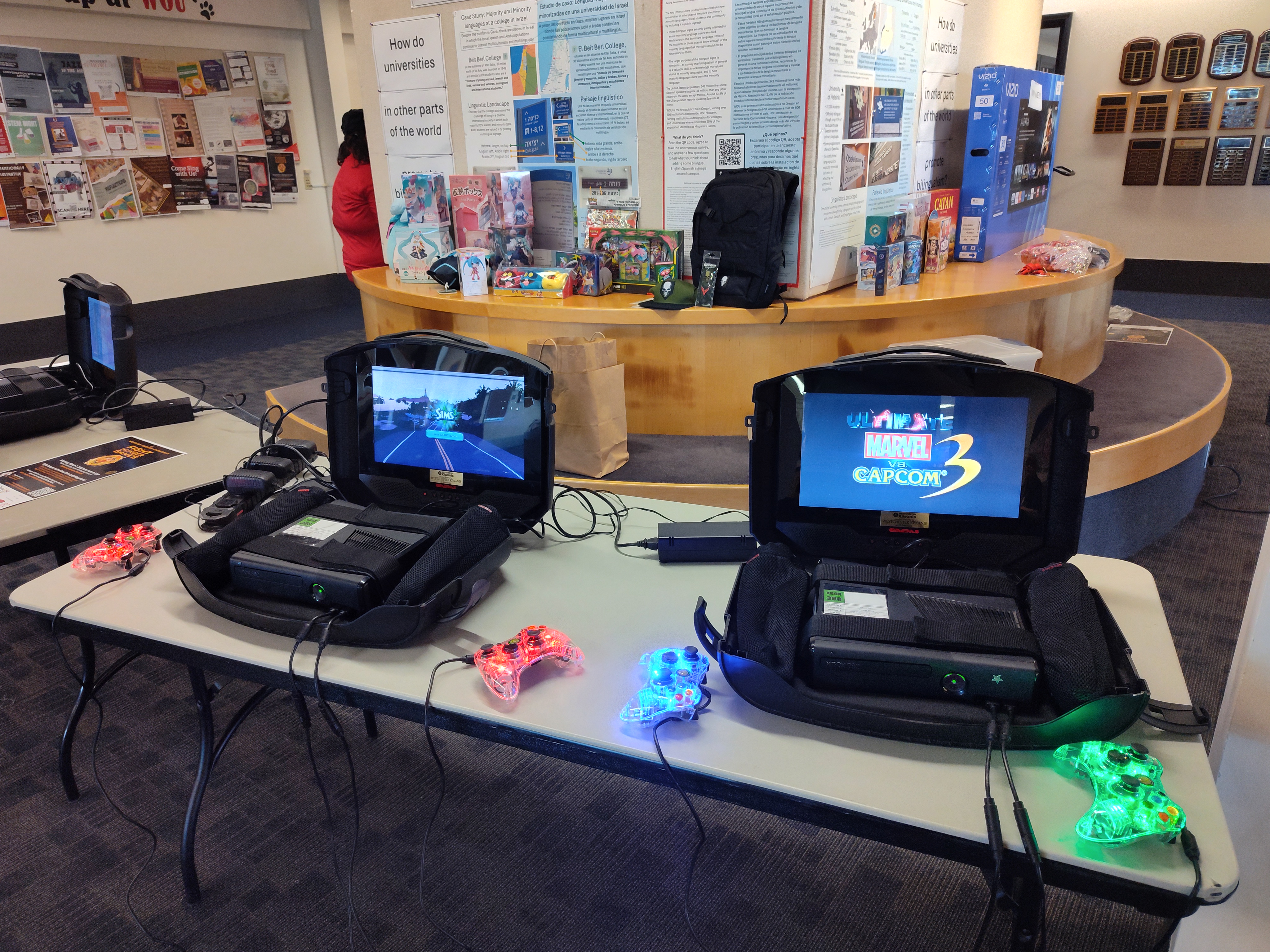 Consoles with miscellaneous video games set up.