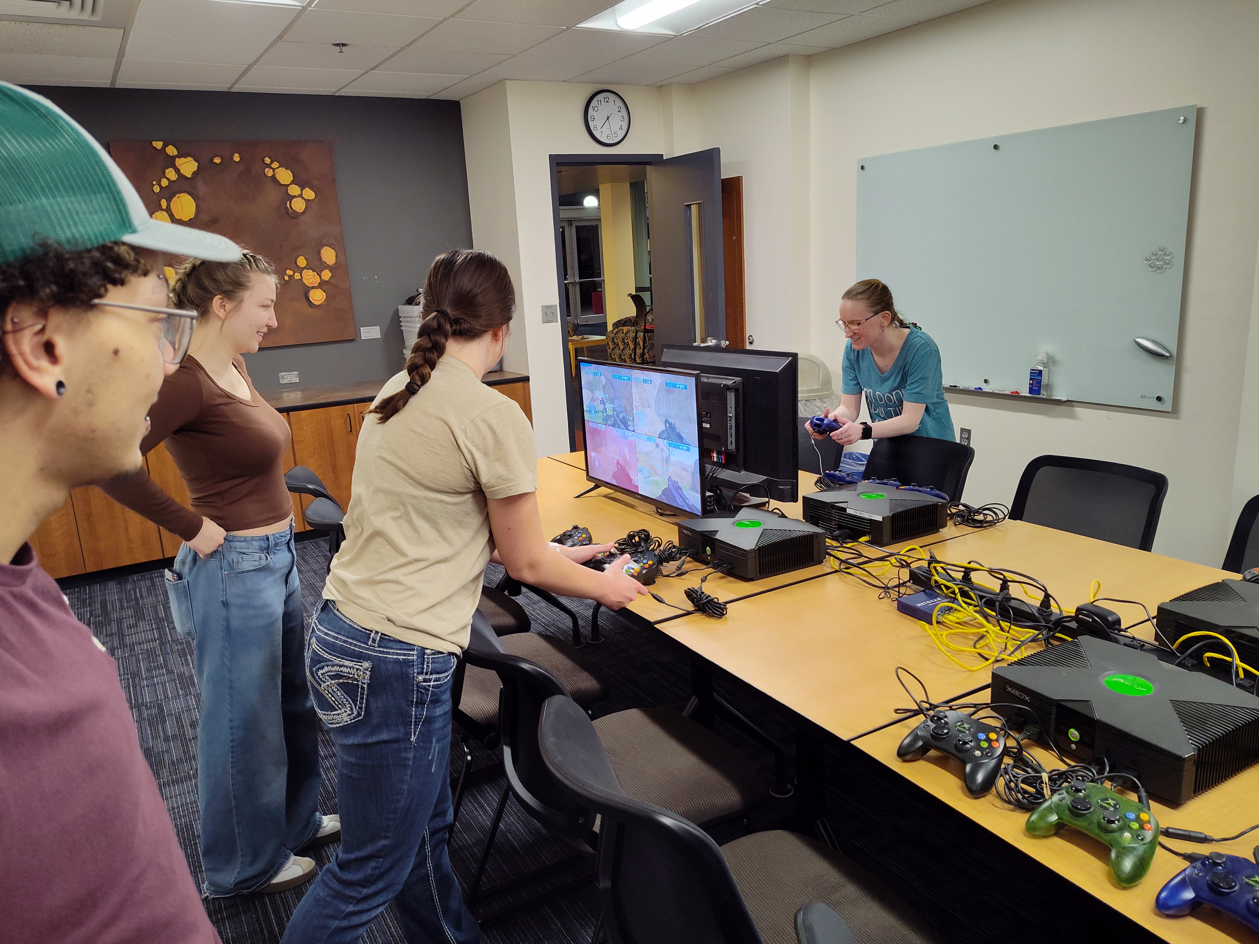 Students playing Halo on Xbox.