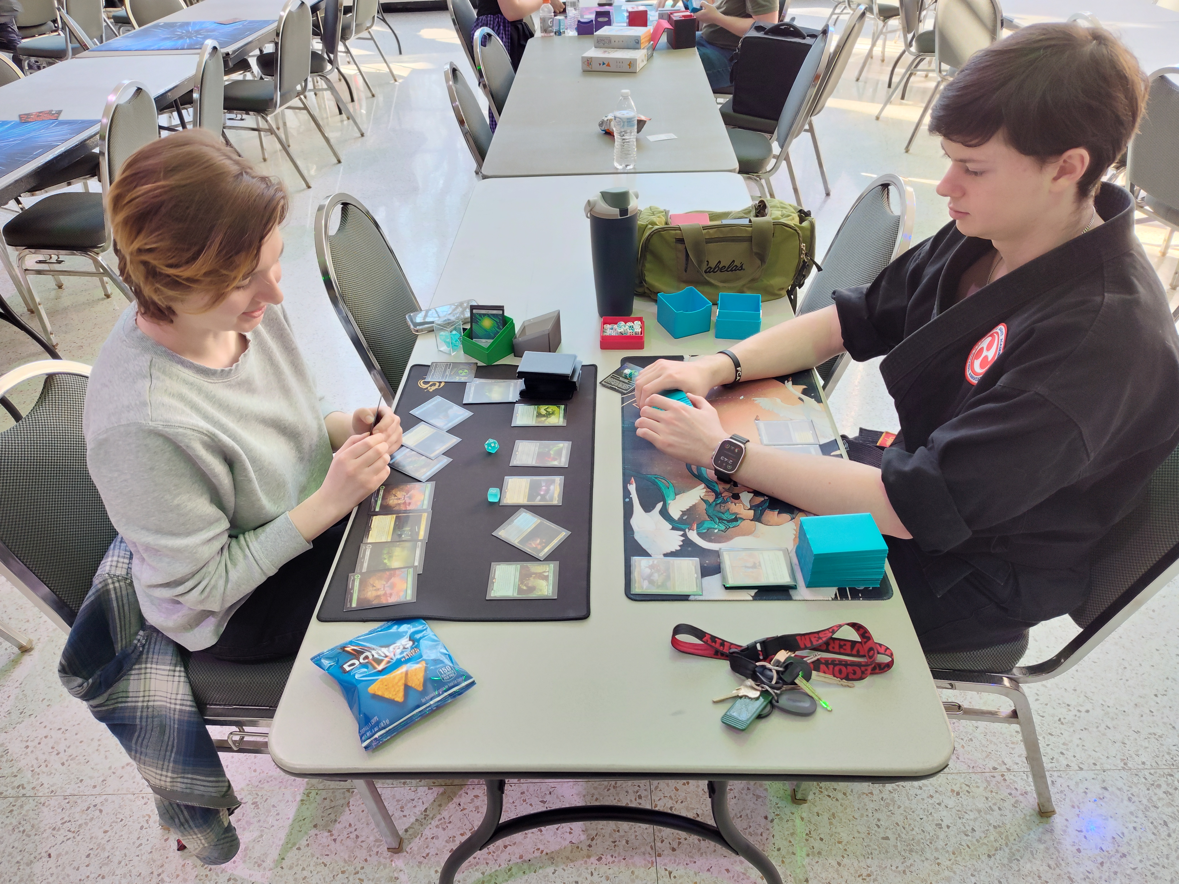 Two students playing Magic: The Gathering.