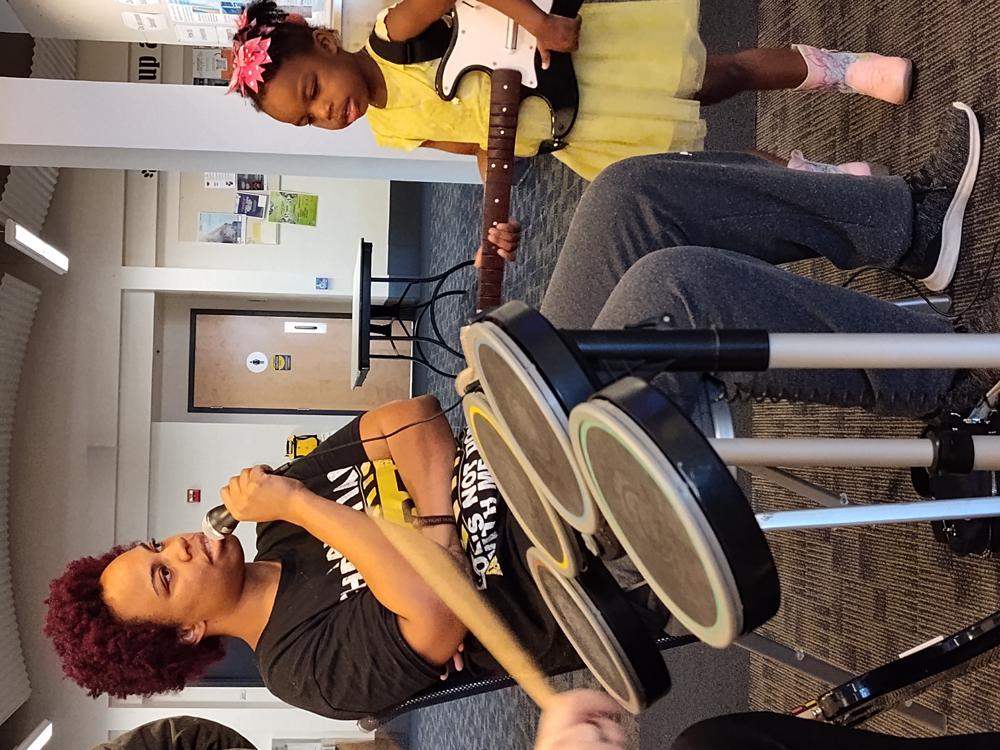 People playing Rock Band.