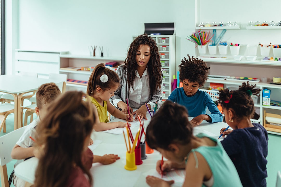 Teacher instructs her class of elementary students
