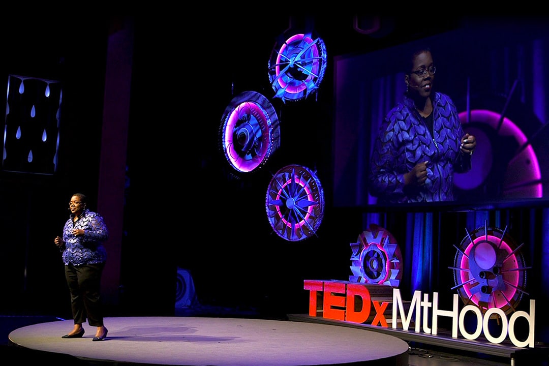A speaker addresses the crowd at TEDxMtHood.