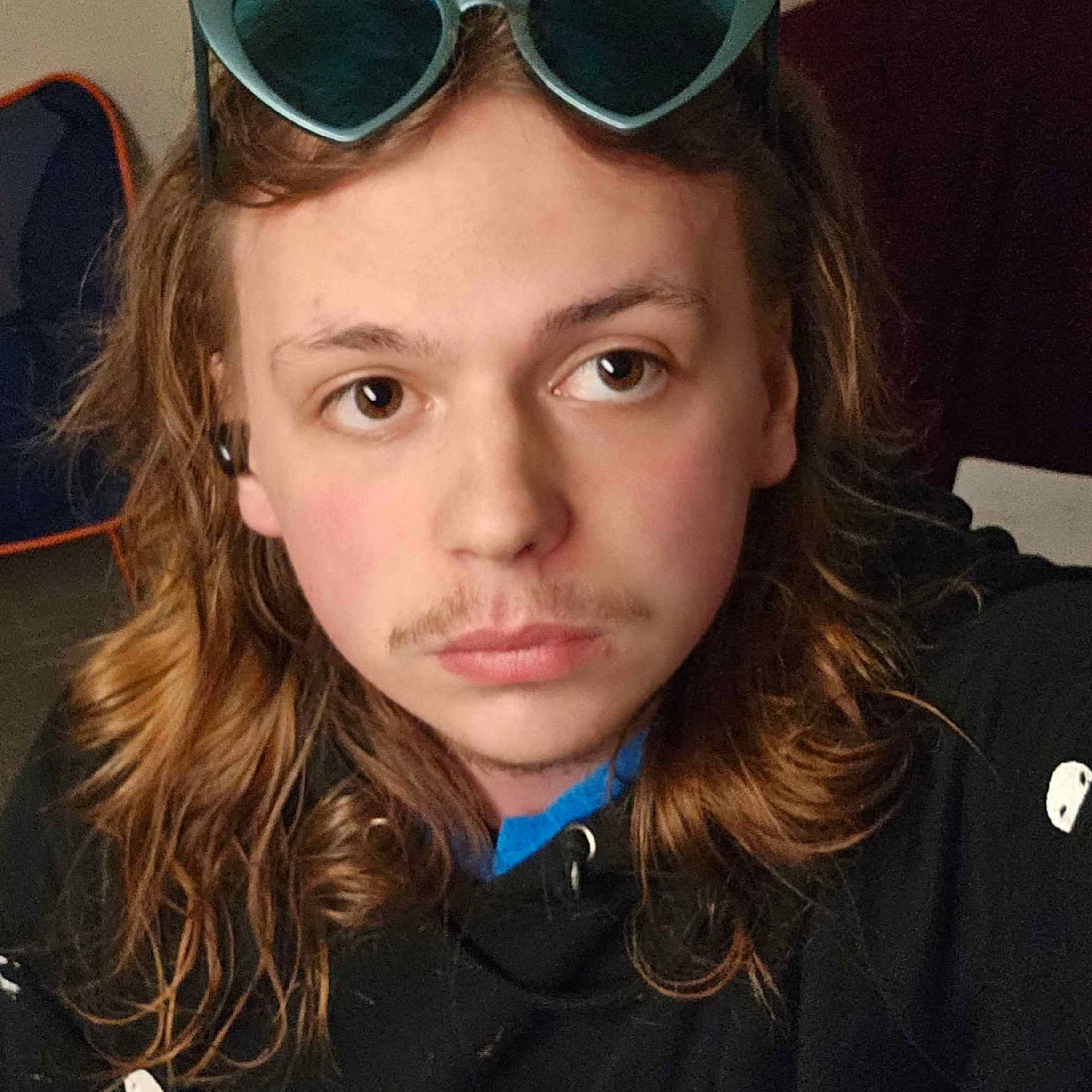 Young person with glasses.