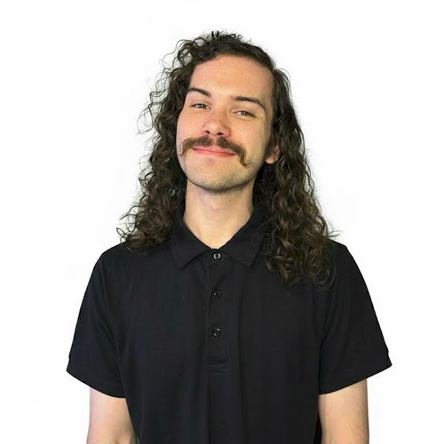 image_png Smiling young person with brown hair.